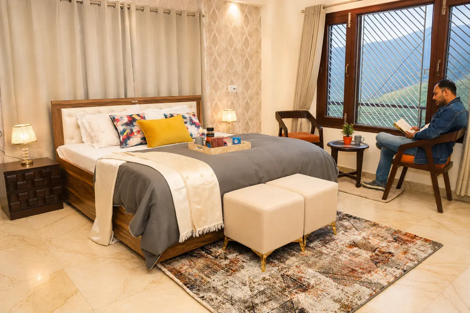 Bedroom 2 with a king bed and window at Noon Villa