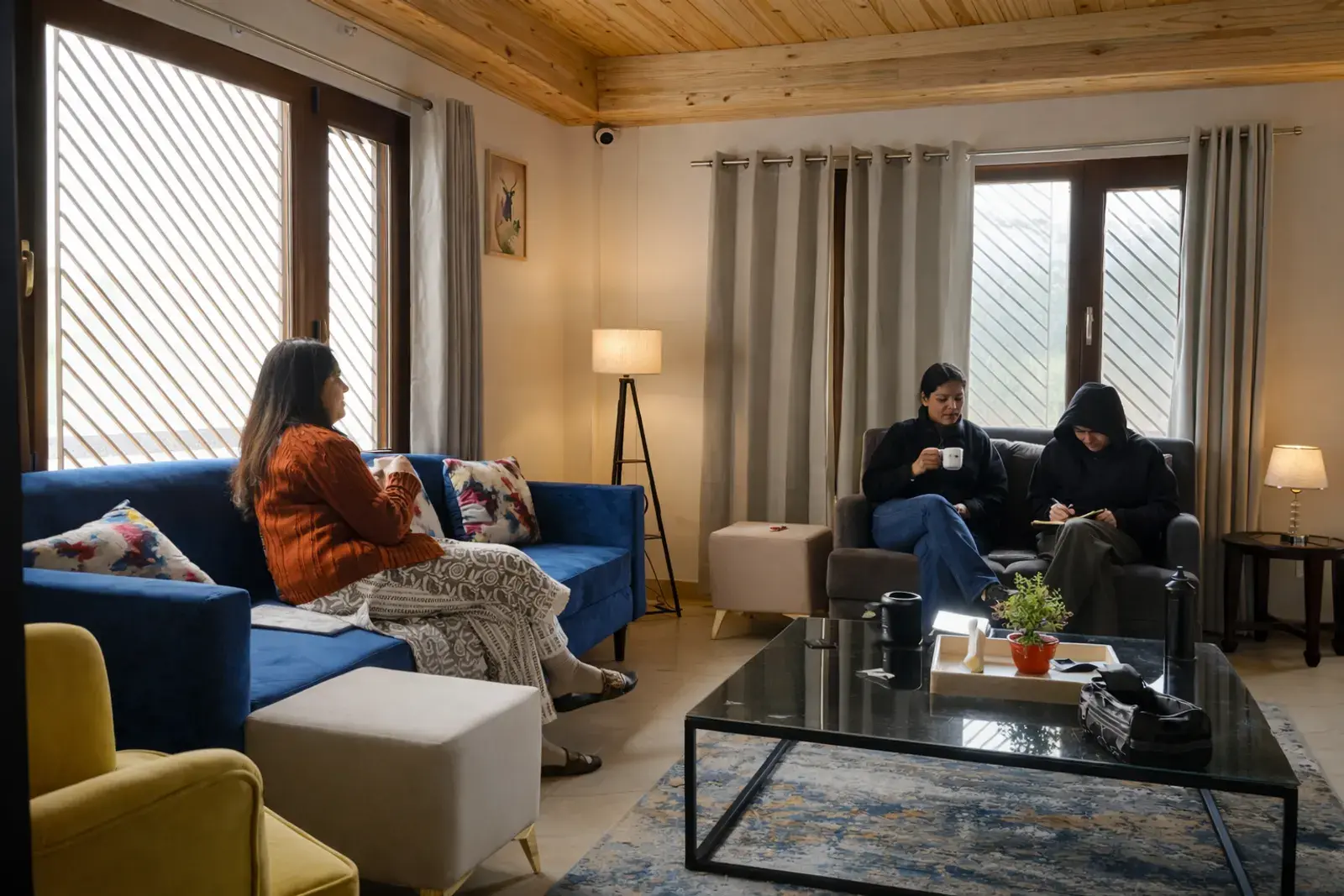Main living area with family seating at Noon Villa